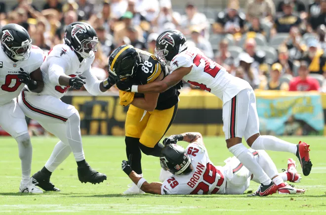 Sep 13, 2026; Pittsburgh, Pennsylvania, USA;  Pittsburgh Steelers tight end Pat Freiermuth (88) is tackled by Atlanta Falcons cornerback A.J. Terrell Jr. (24) and defensive back Sydney Brown (29) during the first quarter at Acrisure Stadium.  Mandatory Credit: Charles LeClaire-Imagn Images