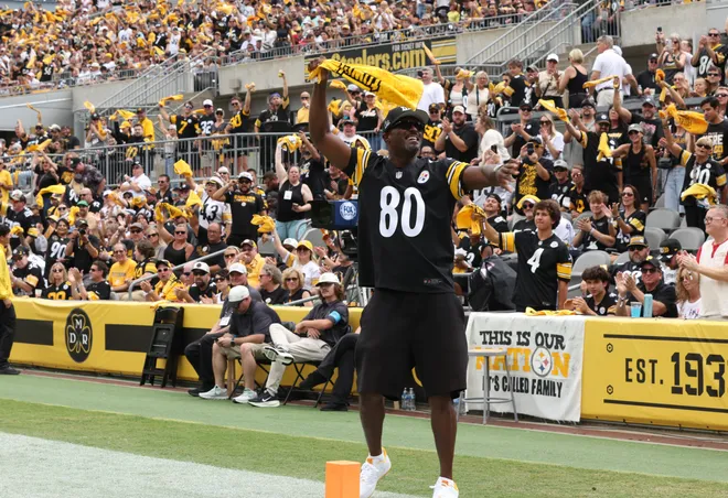 Sep 13, 2026; Pittsburgh, Pennsylvania, USA;  Former Pittsburgh Steelers player Plaxico Burress waves a terrible towel during the first quarter against the Atlanta Falcons at Acrisure Stadium.  Mandatory Credit: Charles LeClaire-Imagn Images
