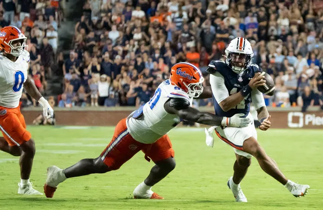 Auburn Tigers quarterback Byrum Brown (17) runs the ball as Auburn Tigers take on Florida Gators at Jordan-Hare Stadium in Auburn, Ala. on Saturday, Sept. 19, 2026. Florida Gators lead Auburn Tigers 20-17 at halftime.