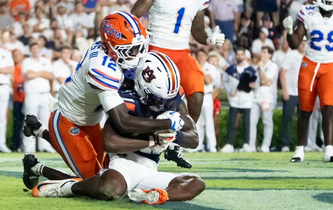 Auburn Tigers wide receiver Keshaun Singleton (11) catches a touchdown pass as Auburn Tigers take on Florida Gators at Jordan-Hare Stadium in Auburn, Ala. on Saturday, Sept. 19, 2026. Florida Gators lead Auburn Tigers 20-17 at halftime.