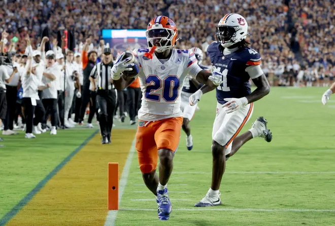Sep 19, 2026; Auburn, Alabama, USA;  Florida Gators running back Duke Clark (20) scores a touchdown against the Auburn Tigers during the second quarter at Jordan-Hare Stadium.  Mandatory Credit: John Reed-Imagn Images
