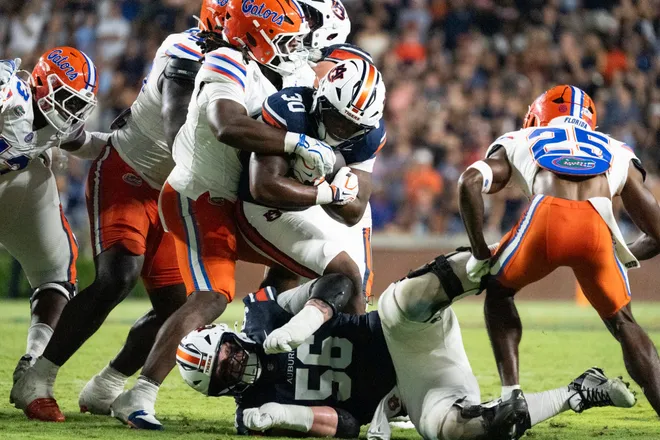 Auburn Tigers running back Bryson Washington (30) runs the ball as Auburn Tigers take on Florida Gators at Jordan-Hare Stadium in Auburn, Ala. on Saturday, Sept. 19, 2026. Florida Gators lead Auburn Tigers 20-17 at halftime.