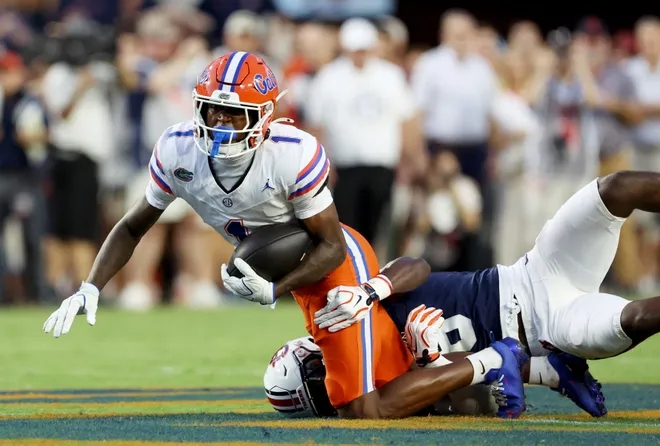 Sep 19, 2026; Auburn, Alabama, USA;  Florida Gators wide receiver Vernell Brown III (1) is tackled by Auburn Tigers linebacker Elijah Melendez (9) during the first quarter at Jordan-Hare Stadium.  Mandatory Credit: John Reed-Imagn Images