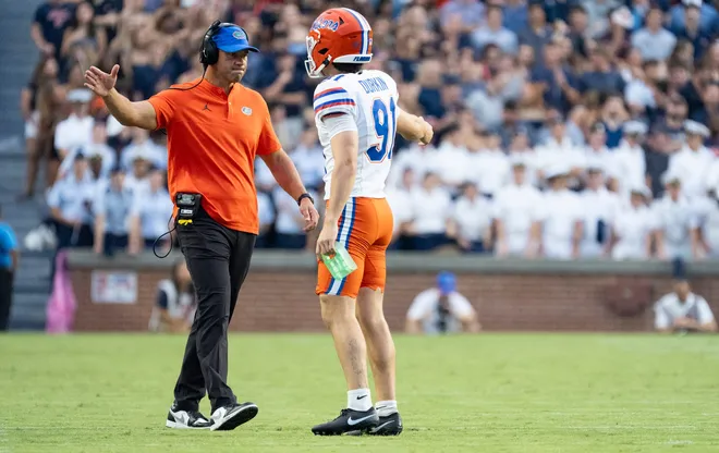 Florida Gators head coach Jon Sumrall high fives kicker Patrick Durkin (91) as Auburn Tigers take on Florida Gators at Jordan-Hare Stadium in Auburn, Ala. on Saturday, Sept. 19, 2026.
