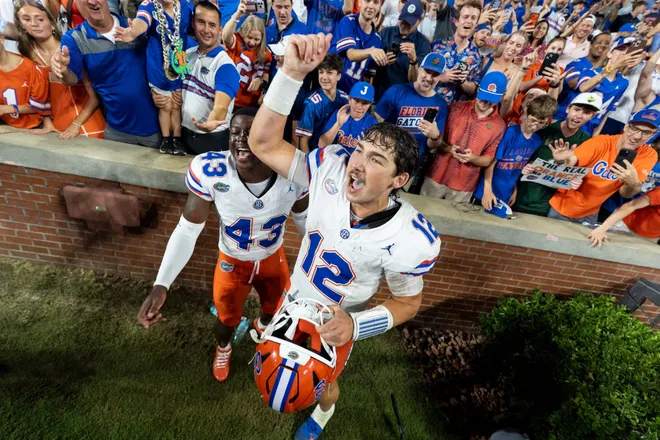 Florida Gators quarterback Aaron Philo (12) celebrates with fans after the game as Auburn Tigers take on Florida Gators at Jordan-Hare Stadium in Auburn, Ala. on Saturday, Sept. 19, 2026. Florida Gators defeated Auburn Tigers 44-39.