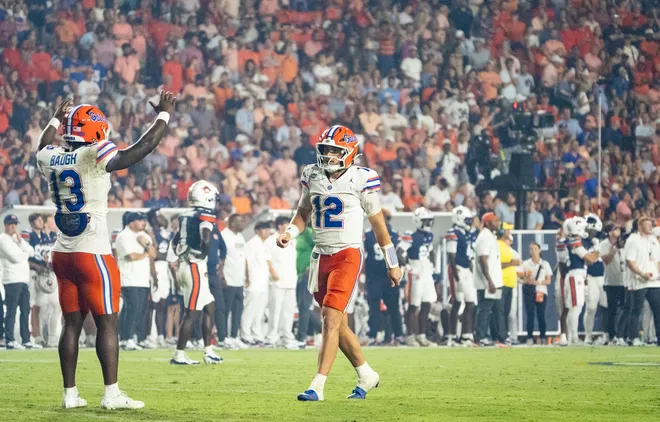 Florida Gators running back Jadan Baugh (13) and quarterback Aaron Philo (12) celebrate a touchdown as Auburn Tigers take on Florida Gators at Jordan-Hare Stadium in Auburn, Ala. on Saturday, Sept. 19, 2026. Florida Gators defeated Auburn Tigers 44-39.