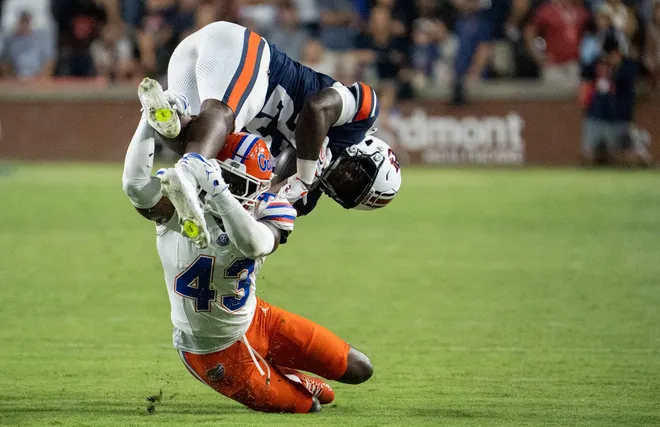 Florida Gators safety Alfonzo Allen Jr. (43) tackles Auburn Tigers safety Fred Gaskin III (23) on a kickoff as Auburn Tigers take on Florida Gators at Jordan-Hare Stadium in Auburn, Ala. on Saturday, Sept. 19, 2026. Florida Gators defeated Auburn Tigers 44-39.