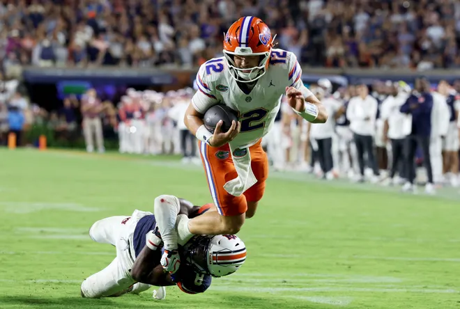Sep 19, 2026; Auburn, Alabama, USA;  Auburn Tigers defensive back Kaleb Harris (8) tackled Florida Gators quarterback Aaron Philo (12) during the third quarter at Jordan-Hare Stadium.  Mandatory Credit: John Reed-Imagn Images