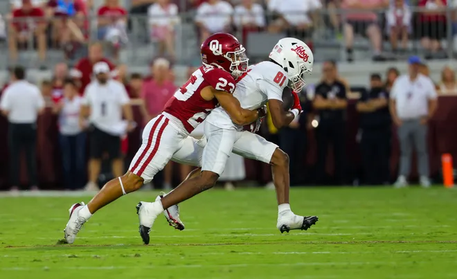 Sep 19, 2026; Norman, Oklahoma, USA; New Mexico Lobos wide receiver Bailen George (81) makes a catch as Oklahoma Sooners defensive back Eli Bowen (23) defends during the second quarter at Gaylord Family-Oklahoma Memorial Stadium. Mandatory Credit: Kevin Jairaj-Imagn Images