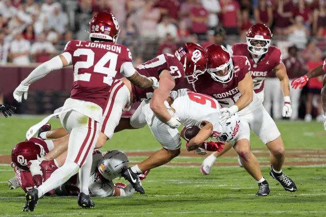 Oklahoma Sooners linebacker James Nesta (47) and Oklahoma Sooners linebacker Owen Heinecke (38) bring down New Mexico Lobos wide receiver Jacob Maldonado (16) during a college football game between the University of Oklahoma Sooners (OU) and the New Mexico Lobos at Gaylord Family-Oklahoma Memorial Stadium in Norman, Okla., Saturday, Sept. 19, 2026. Oklahoma won 14-6.