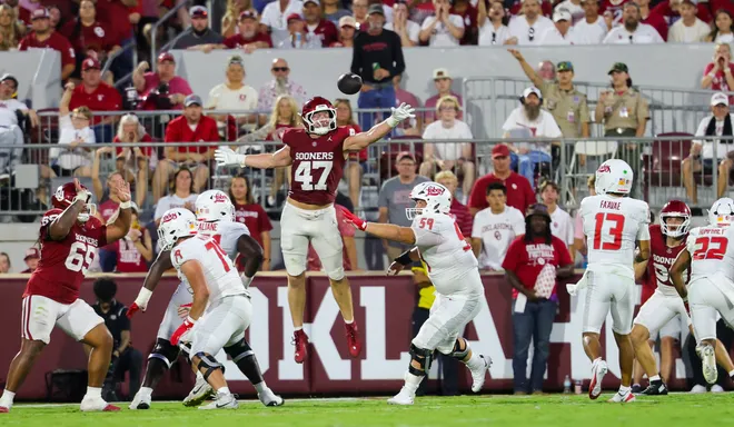 Sep 19, 2026; Norman, Oklahoma, USA; Oklahoma Sooners linebacker James Nesta (47) leaps but cannot bat down a pass by New Mexico Lobos quarterback Toa Fa'avae (13) during the second quarter at Gaylord Family-Oklahoma Memorial Stadium. Mandatory Credit: Kevin Jairaj-Imagn Images