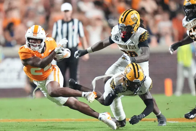 Sept. 19, 2026; Knoxville, Tennessee; Tennessee running back Hunter Barnes (24) gets tripped up during a game between Tennessee and Kennesaw State at Neyland Stadium in Knoxville, Tennessee on Sept. 19, 2026.