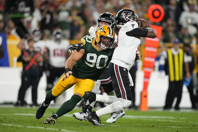 Sep 24, 2026; Green Bay, Wisconsin, USA;  Green Bay Packers defensive end Lukas Van Ness (90) pressures Atlanta Falcons quarterback Michael Penix Jr. (9) during the first quarter at Lambeau Field.  Mandatory Credit: Jeff Hanisch-Imagn Images