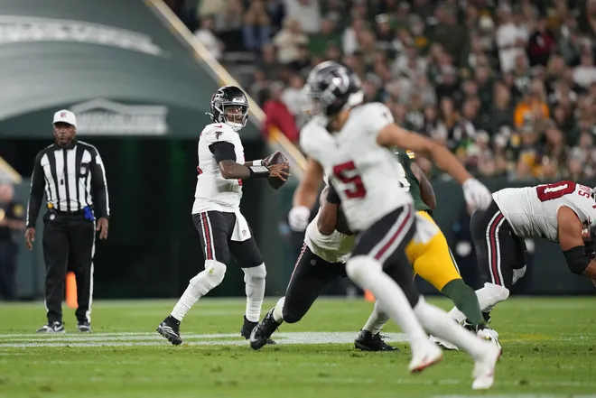 Sep 24, 2026; Green Bay, Wisconsin, USA;  Atlanta Falcons quarterback Michael Penix Jr. (9) looks to pass during the first half against the Green Bay Packers at Lambeau Field.  Mandatory Credit: Jeff Hanisch-Imagn Images