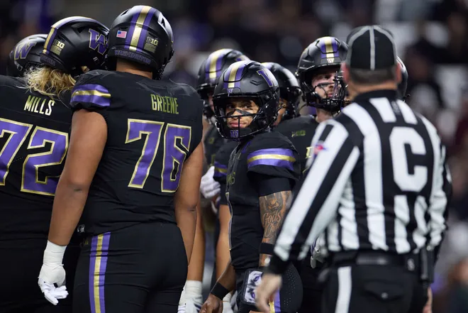 Sep 26, 2026; Seattle, Washington, USA;  Washington Huskies quarterback Demond Williams Jr. (1) goes into a huddle with his team during the first quarter at Husky Stadium.  Mandatory Credit: Richard Dizon-Imagn Images