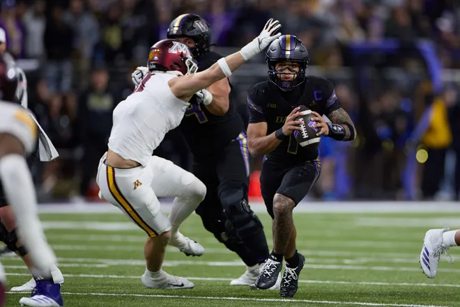 Sep 26, 2026; Seattle, Washington, USA;  Washington Huskies quarterback Demond Williams Jr. (1) rushes for yards against the Minnesota Golden Gophers in the second quarter at Husky Stadium.  Mandatory Credit: Richard Dizon-Imagn Images