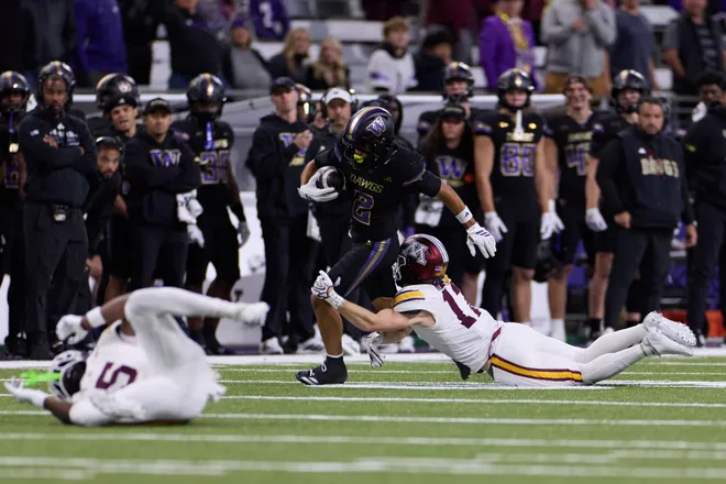 Sep 26, 2026; Seattle, Washington, USA;  Washington Huskies wide receiver Dezmen Roebuck (2) catches a pass against the Minnesota Golden Gophers during the fourth quarter at Husky Stadium.  Mandatory Credit: Richard Dizon-Imagn Images