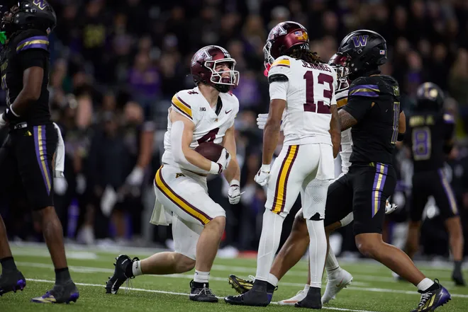 Sep 26, 2026; Seattle, Washington, USA;  Minnesota Golden Gophers tight end Roman Voss (4) celebrates after a play against the Washington Huskies during the third quarter at Husky Stadium.  Mandatory Credit: Richard Dizon-Imagn Images