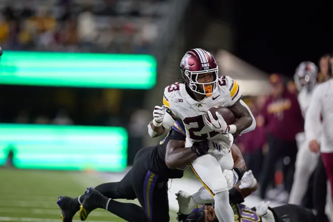 Sep 26, 2026; Seattle, Washington, USA;  Minnesota Golden Gophers running back TJ Thomas Jr. (23) runs for yards against the Washington Huskies during the third quarter at Husky Stadium.  Mandatory Credit: Richard Dizon-Imagn Images