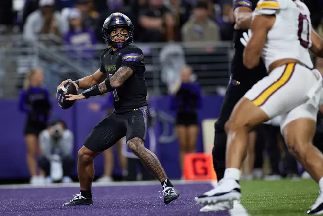 Sep 26, 2026; Seattle, Washington, USA;  Washington Huskies quarterback Demond Williams Jr. (1) looks to pass against the Minnesota Golden Gophers during the third quarter at Husky Stadium.  Mandatory Credit: Richard Dizon-Imagn Images