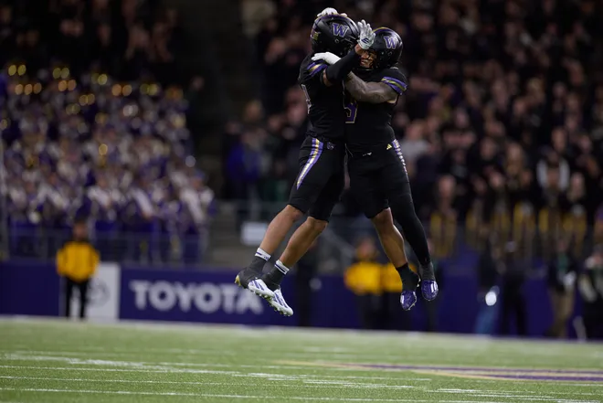 Sep 26, 2026; Seattle, Washington, USA;  Washington Huskies defensive end Isaiah Ward (left) and linebacker Jacob Manu (right) celebrate after a defensive play against the Minnesota Golden Gophers during the fourth quarter at Husky Stadium.  Mandatory Credit: Richard Dizon-Imagn Images