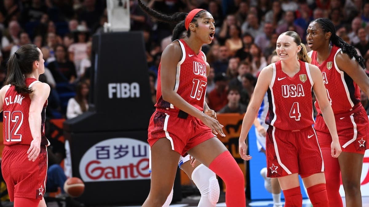 Angel Reese #15 celebrates during USA Basketball Women's National Team game against Italy.