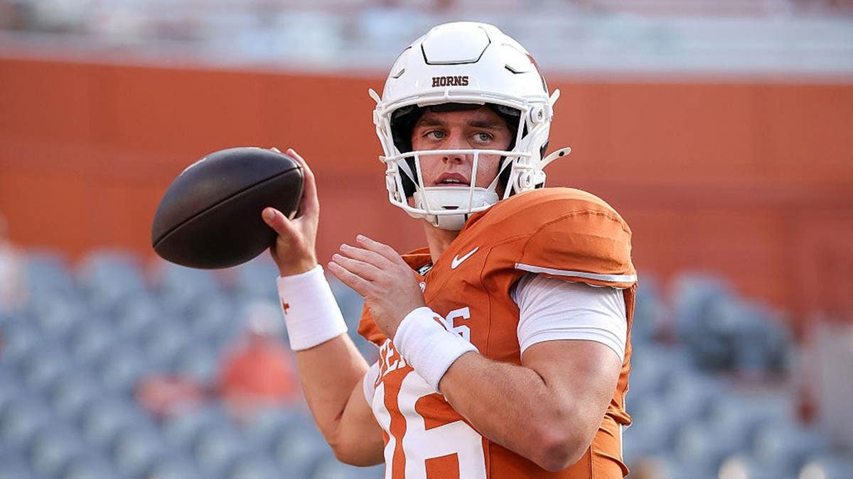 Arch Manning warms up before a game at Darrell K Royal-Texas Memorial Stadium.