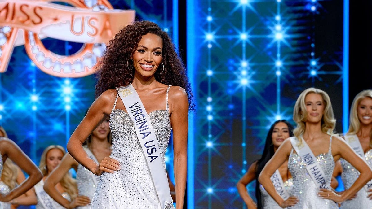 Justus Kelley stands on stage during the Miss USA 2026 final competition and coronation in Miami.