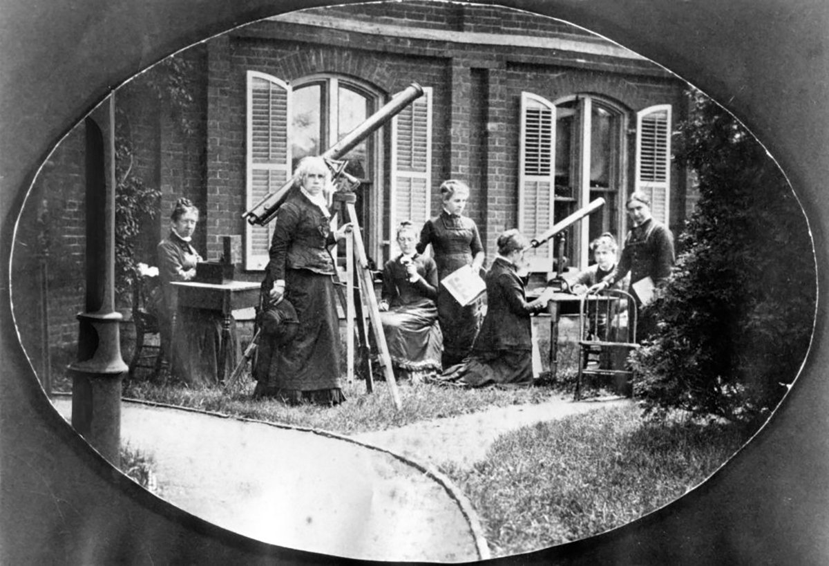Astronomer Maria Mitchell with her astronomy class outside the observatory at Vassar College, Poughkeepsie, New York, USA circa 1870. Photo by Interim Archives/Getty Images