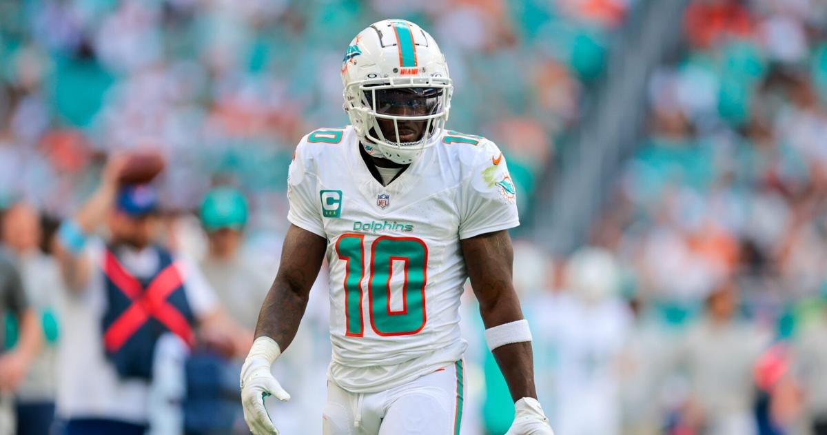Dec 8, 2024; Miami Gardens, Florida, USA; Miami Dolphins wide receiver Tyreek Hill (10) looks on after making a catch against the New York Jets during the first quarter at Hard Rock Stadium. Mandatory Credit: Sam Navarro-Imagn Images