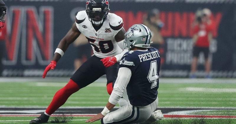Oct 4, 2026; Houston, Texas, USA; Houston Texans Kenneth Murray Jr. (50) makes a tackle on Dallas Cowboys quarterback Dak Prescott (4) during the first quarter at Reliant Stadium. Mandatory Credit: Thomas Shea-Imagn Images | State