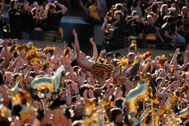 Iowa Hawkeyes fans cheer during the NCAA football game against the Ohio State Buckeyes at Kinnick Stadium in Iowa City on Oct. 3, 2026.
