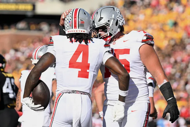 Oct 3, 2026; Iowa City, Iowa, USA;  Ohio State Buckeyes wide receiver Jeremiah Smith (4) celebrates with cornerback Jordan Thomas (15) after scoring a touchdown against the Iowa Hawkeyes during the first half at Kinnick Stadium.  Mandatory Credit: Jeffrey Becker-Imagn Images