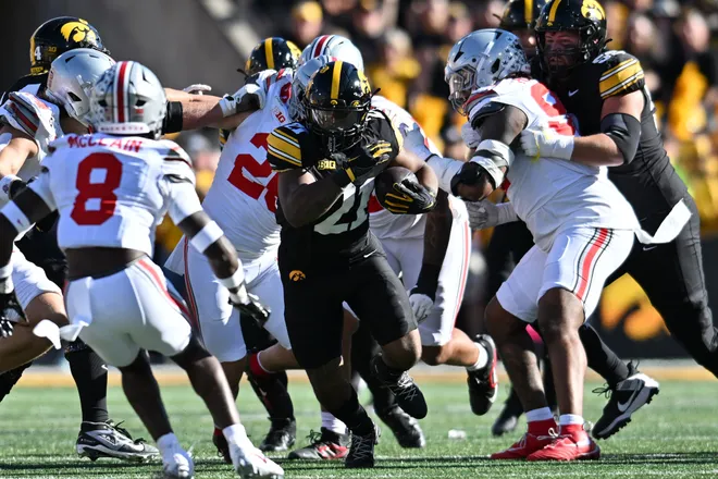 Oct 3, 2026; Iowa City, Iowa, USA;  Iowa Hawkeyes running back L.J. Phillips Jr. (21) runs against the Ohio State Buckeyes during the first half at Kinnick Stadium.  Mandatory Credit: Jeffrey Becker-Imagn Images