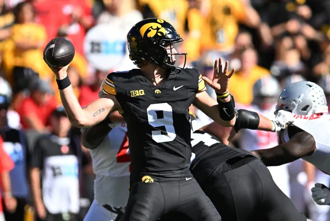 Oct 3, 2026; Iowa City, Iowa, USA;  Iowa Hawkeyes quarterback Hank Brown (9) passes against the Ohio State Buckeyes during the first half at Kinnick Stadium.  Mandatory Credit: Jeffrey Becker-Imagn Images