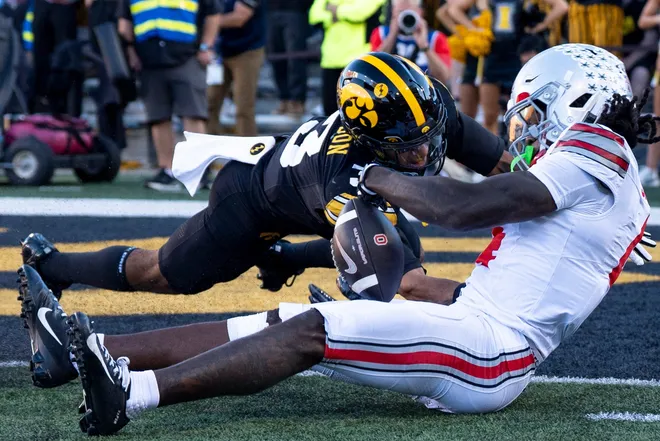 Iowa Hawkeyes defensive back Jaylen Watson (3) defends a pass meant for Ohio State Buckeyes wide receiver Jeremiah Smith (4) Oct. 3, 2026 at Kinnick Stadium in Iowa City, Iowa.