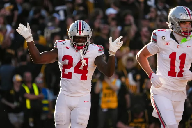 Ohio State Buckeyes running back Ja'kobi Jackson (24) celebrates a touchdown during the NCAA football game against the Iowa Hawkeyes at Kinnick Stadium in Iowa City on Oct. 3, 2026. Ohio State on 31-14.