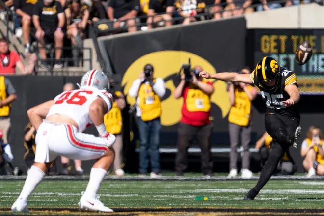 Iowa Hawkeyes kicker Eli Ozick (25) kicks the ball to the Ohio State Buckeyes during a Big Ten college football game Oct. 3, 2026 at Kinnick Stadium in Iowa City, Iowa.