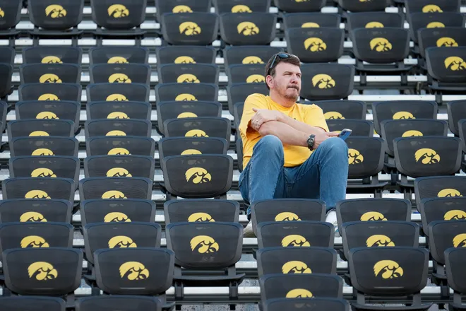 Iowa Hawkeyes fans sit in the stands following the 31-14 loss to the Ohio State Buckeyes in the NCAA football game at Kinnick Stadium in Iowa City on Oct. 3, 2026.