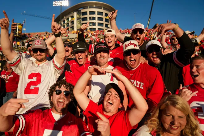 Ohio State Buckeyes fans celebrate following the 31-14 win over the Iowa Hawkeyes in the NCAA football game at Kinnick Stadium in Iowa City on Oct. 3, 2026.