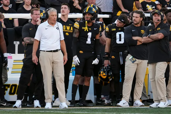 Iowa Hawkeyes head coach Kirk Ferentz, left, watches during the NCAA football game against the Ohio State Buckeyes at Kinnick Stadium in Iowa City on Oct. 3, 2026.
