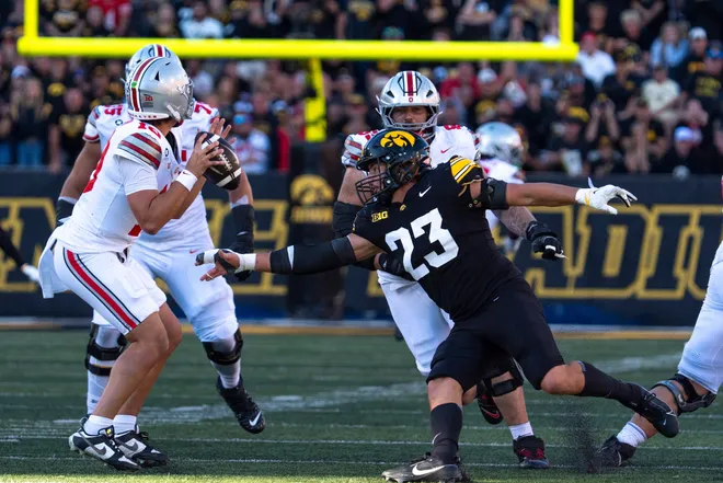 Iowa Hawkeyes linebacker Landyn van Kekerix (23) pressures Ohio State Buckeyes quarterback Julian Sayin (10) during a Big Ten college football game Oct. 3, 2026 at Kinnick Stadium in Iowa City, Iowa.