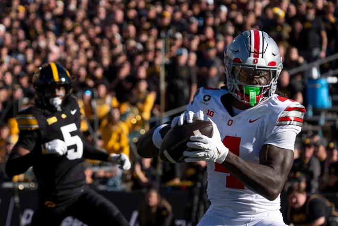 Ohio State Buckeyes wide receiver Jeremiah Smith (4) catches the football against the Iowa Hawkeyes Oct. 3, 2026 at Kinnick Stadium in Iowa City, Iowa. Smith scored a touchdown on the play.
