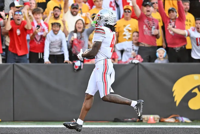Oct 3, 2026; Iowa City, Iowa, USA;  Ohio State Buckeyes wide receiver Jeremiah Smith (4) scores a touchdown against the Iowa Hawkeyes during the second half at Kinnick Stadium.  Mandatory Credit: Jeffrey Becker-Imagn Images