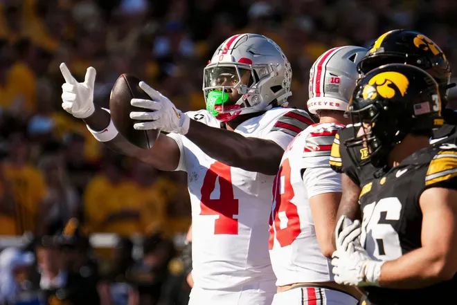 Ohio State Buckeyes wide receiver Jeremiah Smith (4) reacts to a first down catch during the NCAA football game against the Iowa Hawkeyes at Kinnick Stadium in Iowa City on Oct. 3, 2026.