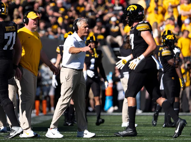 Iowa Hawkeyes head coach Kirk Ferentz high fives Iowa Hawkeyes tight end Addison Ostrenga (87) during a Big Ten college football game against the Ohio State Buckeyes Oct. 3, 2026 at Kinnick Stadium in Iowa City, Iowa.