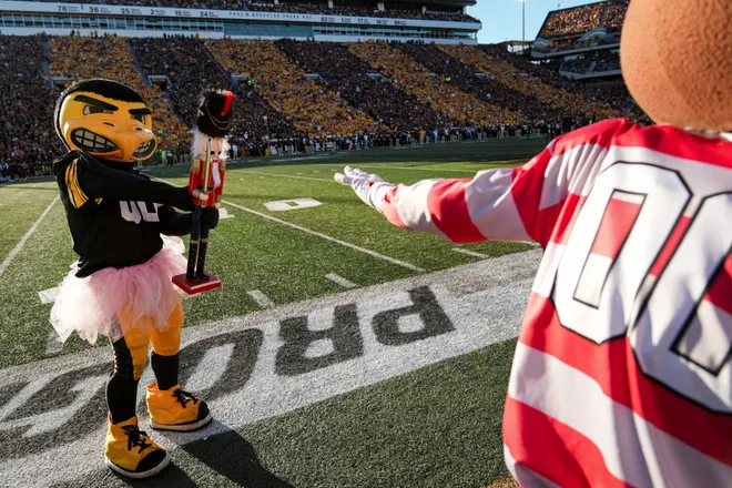 Iowa Hawkeyes mascot Herky shows a nutcracker to Ohio State Buckeyes mascot Brutus during the NCAA football game at Kinnick Stadium in Iowa City on Oct. 3, 2026.