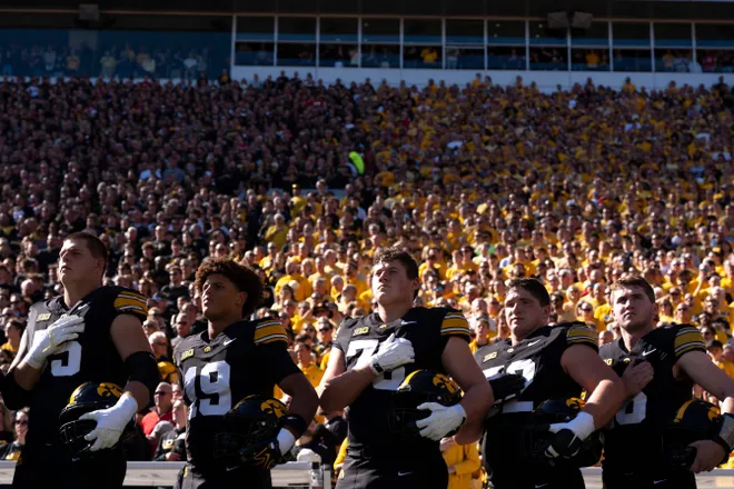 Iowa players stand for the national anthem before a Big Ten college football game against the Ohio State Buckeyes at Kinnick Stadium in Iowa City, Iowa, on Oct. 3, 2026.