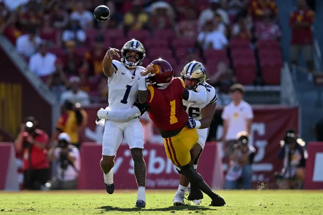 Oct 3, 2026; Los Angeles, California, USA;  Washington Huskies quarterback Demond Williams Jr. (1) passes the ball against the USC Trojans during the first quarter at United Airlines Field at Los Angeles Memorial Coliseum.  Mandatory Credit: Griffin Hooper-Imagn Images