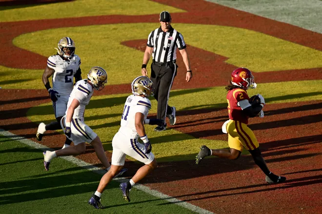 Oct 3, 2026; Los Angeles, California, USA;  USC Trojans running back Waymond Jordan (2) scores a rushing touchdown against the Washington Huskies during the second quarter at United Airlines Field at Los Angeles Memorial Coliseum.  Mandatory Credit: Griffin Hooper-Imagn Images